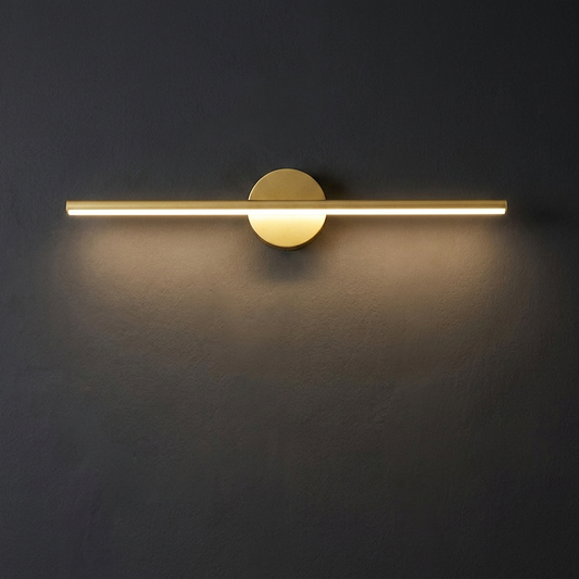 LED vanity strip light in gold on a charcoal plaster wall